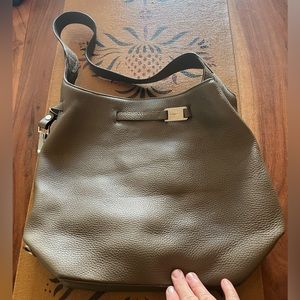 Peter Kent khaki green pebbled leather purse with security features for travel.